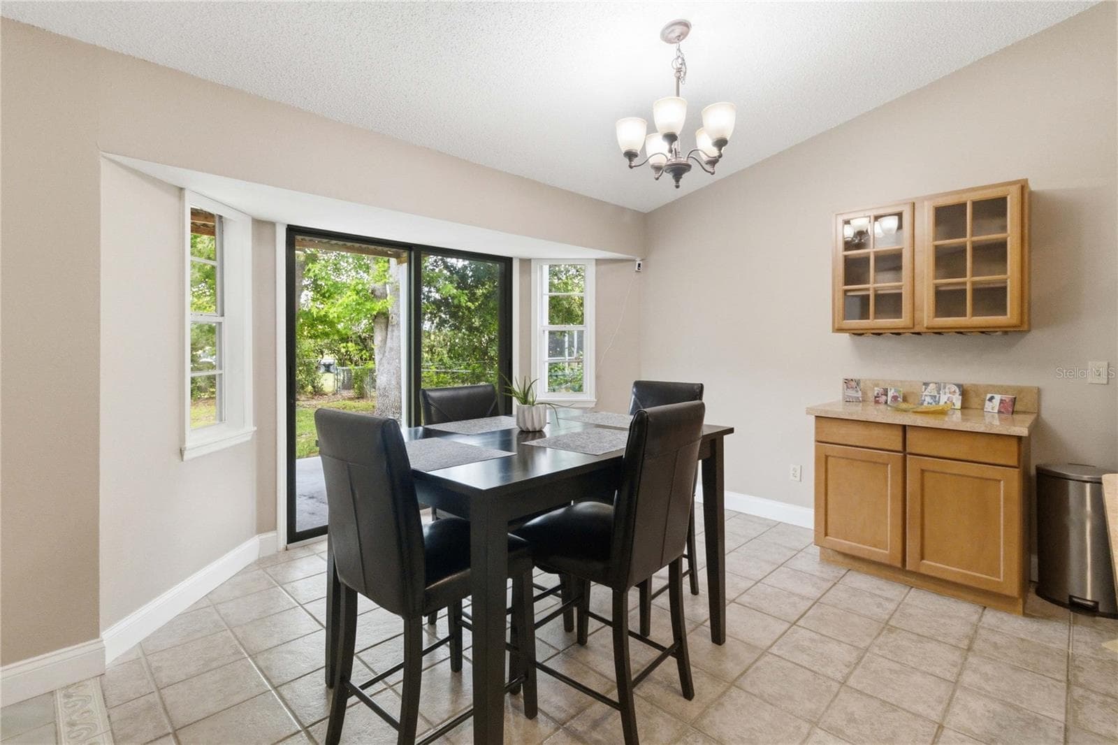 Exit through sliding doors to a covered patio - 1564 CYPRESS WOODS CIR, ST CLOUD