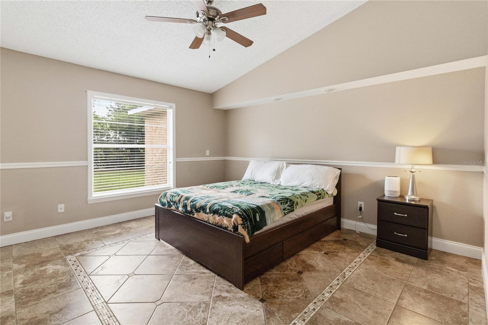 Primary bedroom with chair rail, canister accent lights and accented tile - 1564 CYPRESS WOODS CIR, ST CLOUD