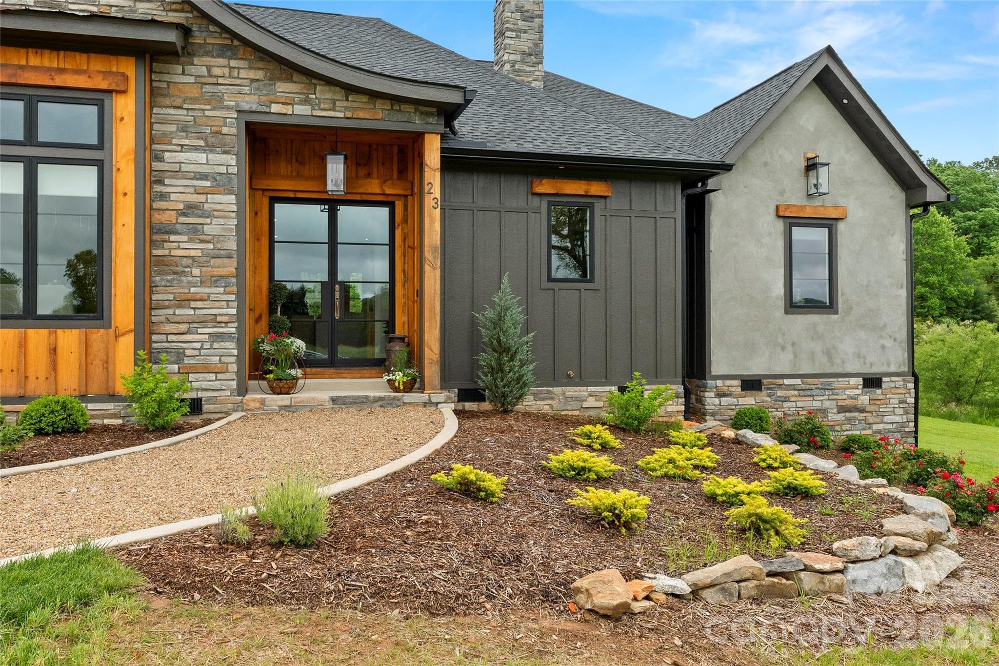 Distinctive architectural details and curated landscaping create exceptional curb appeal. - Horse Shoe