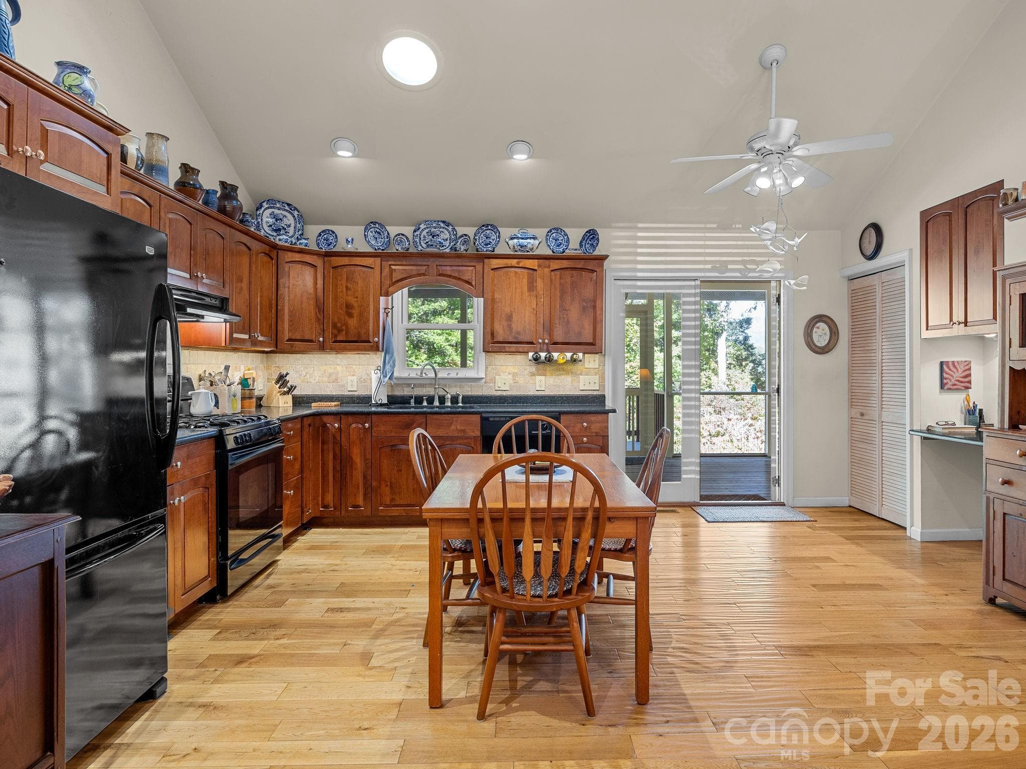 Kitchen with access to screened porch - 160 Caledonia Road, Landrum