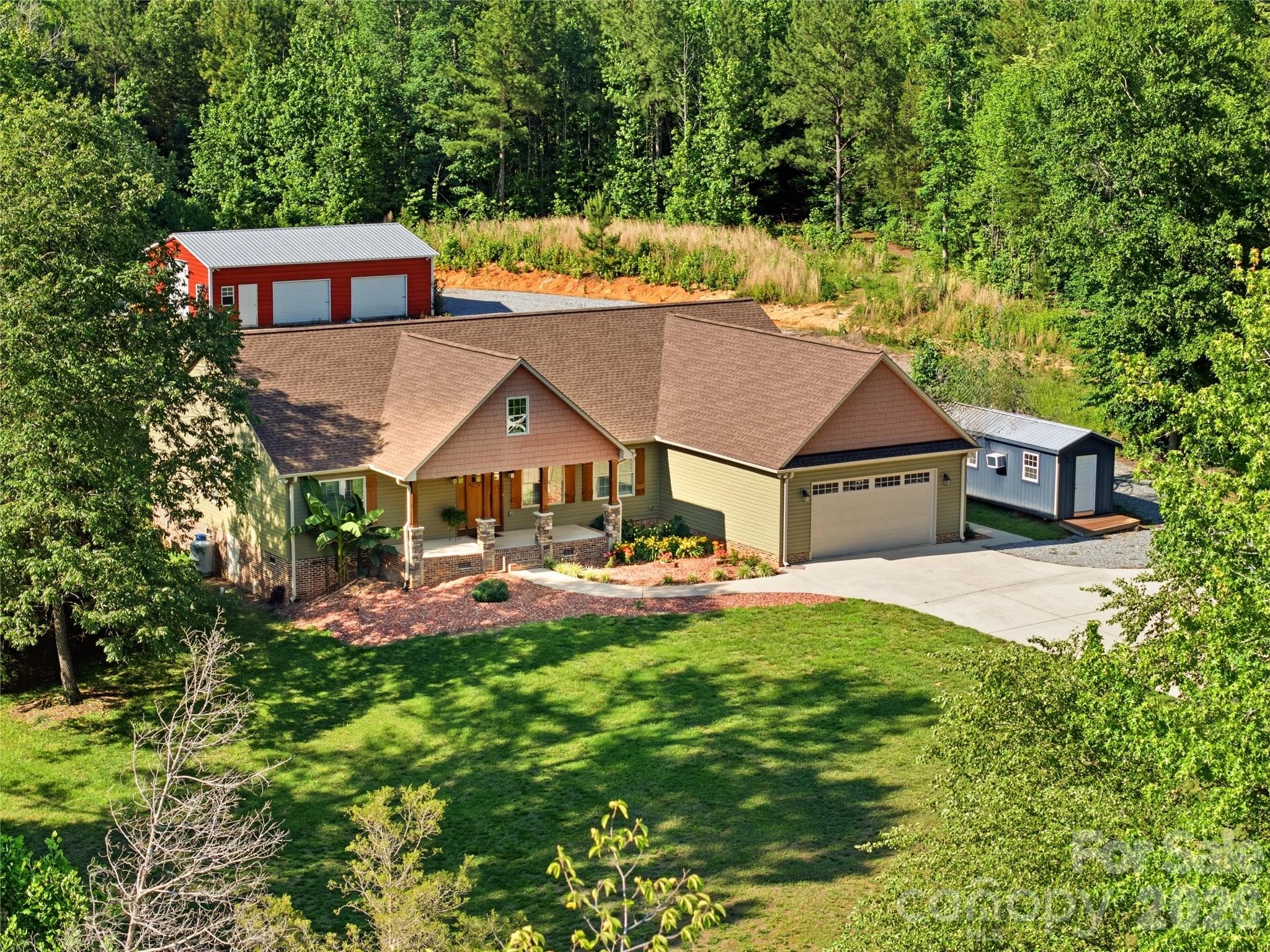 Expansive front view with long private driveway and lush surroundings - Lincolnton
