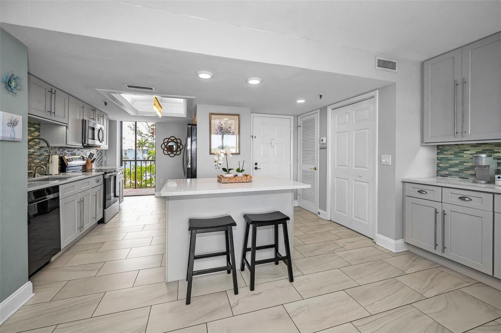 Large Kitchen overlooking the Living area - 19111 VISTA BAY DR #304, INDIAN SHORES