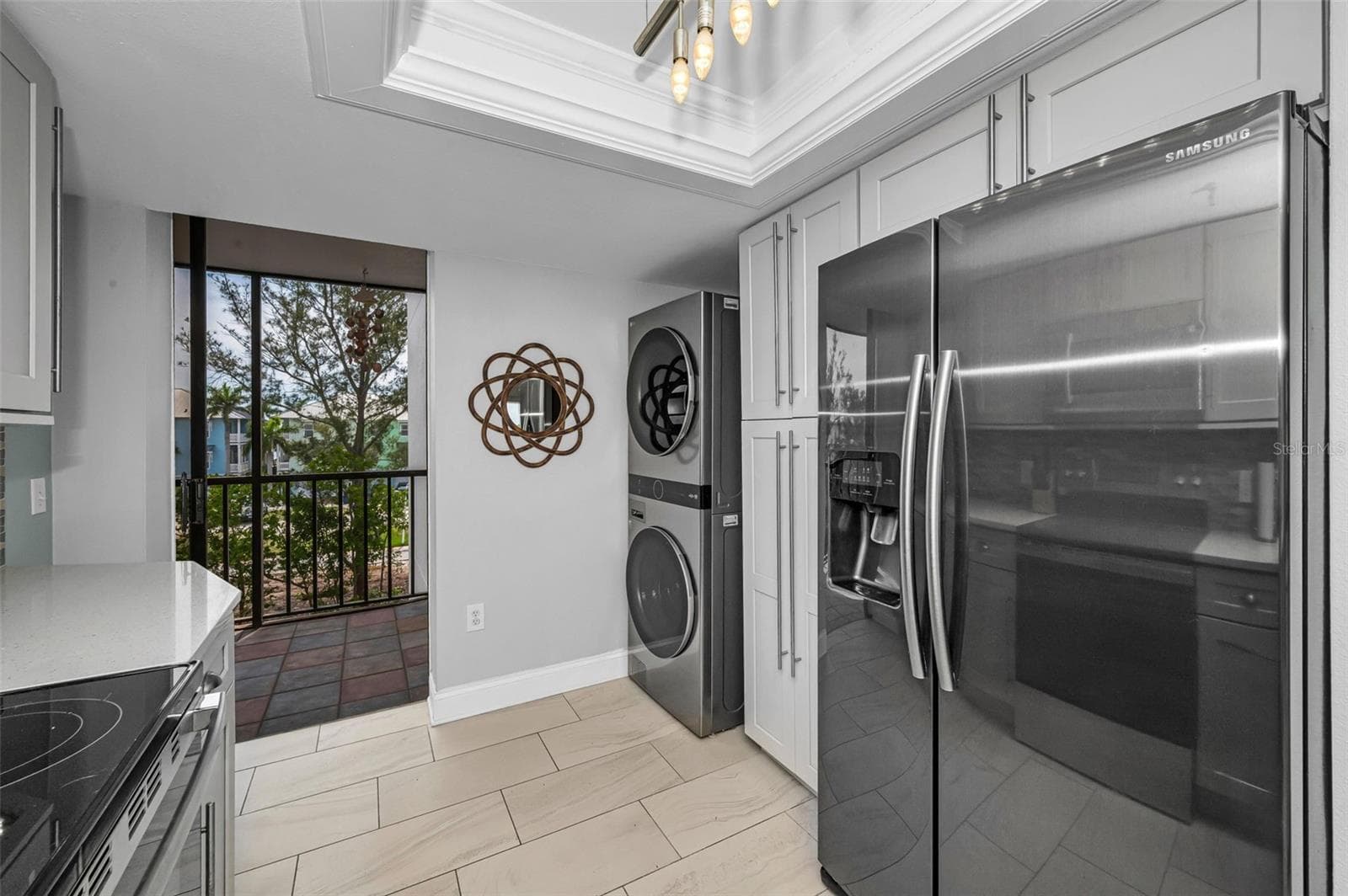 Other view showing the inside washer & dryer and slider to the west facing balcony - 19111 VISTA BAY DR #304, INDIAN SHORES