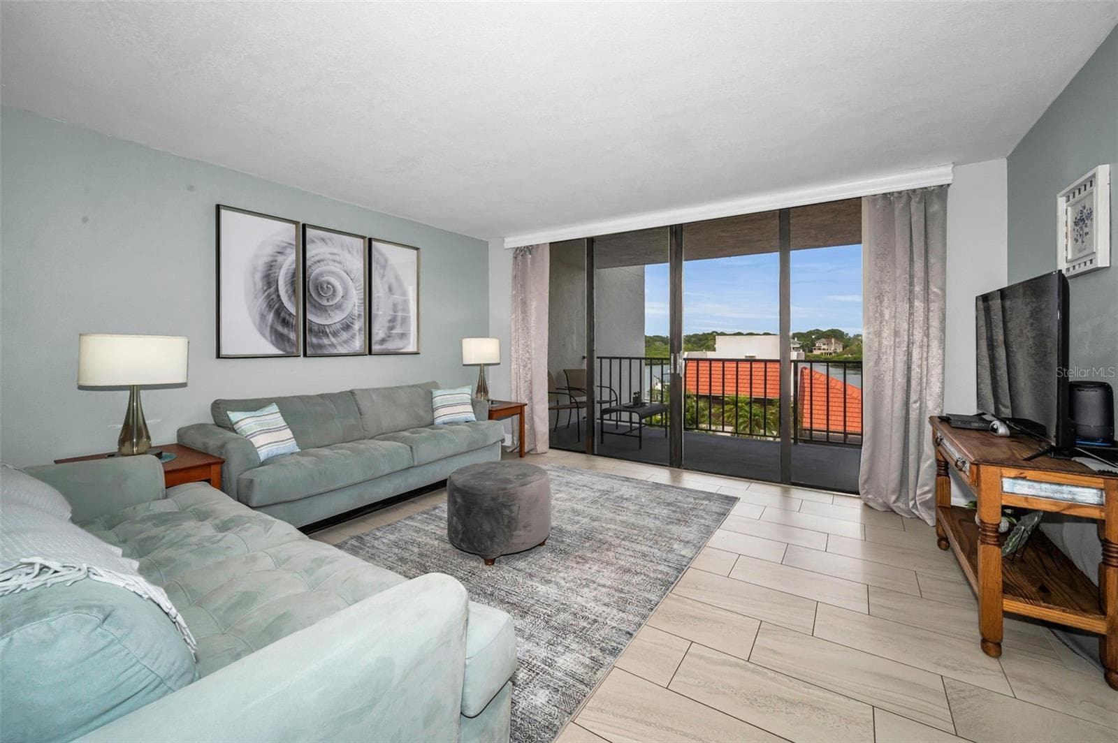 Living Room overlooking the waterfront balcony - 19111 VISTA BAY DR #304, INDIAN SHORES