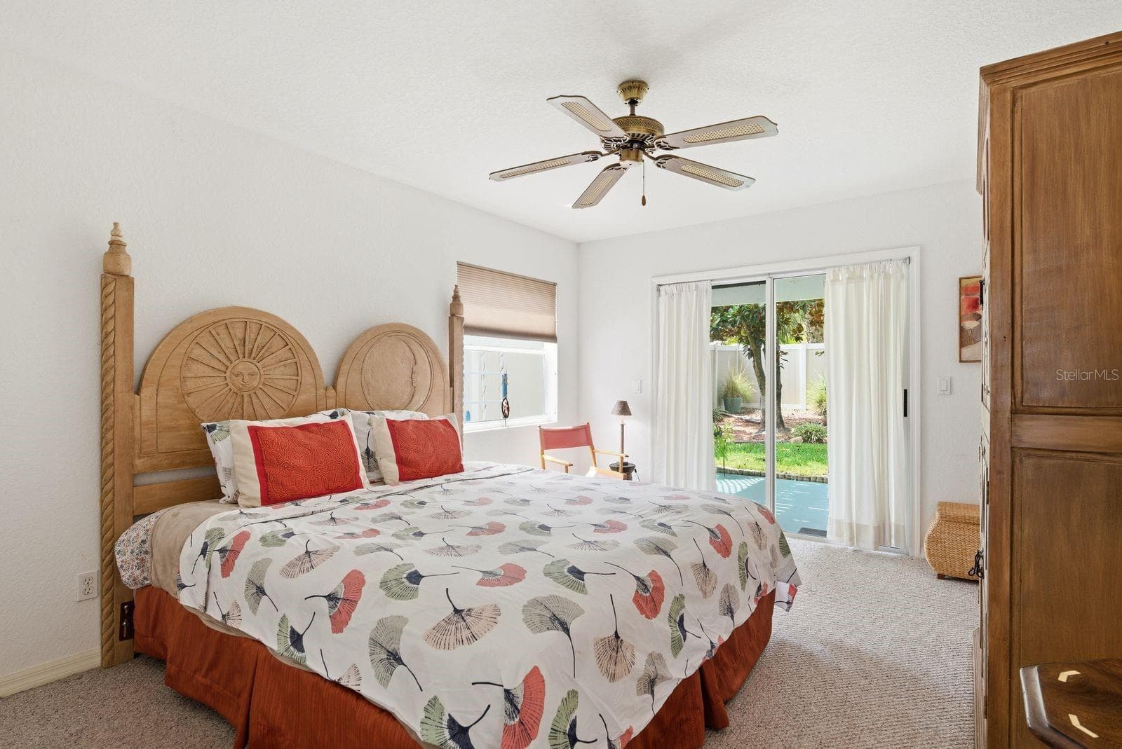 Downstairs Bedroom with sliders to downstairs patio (1). - 755 SAN CHRISTOPHER DR, DUNEDIN