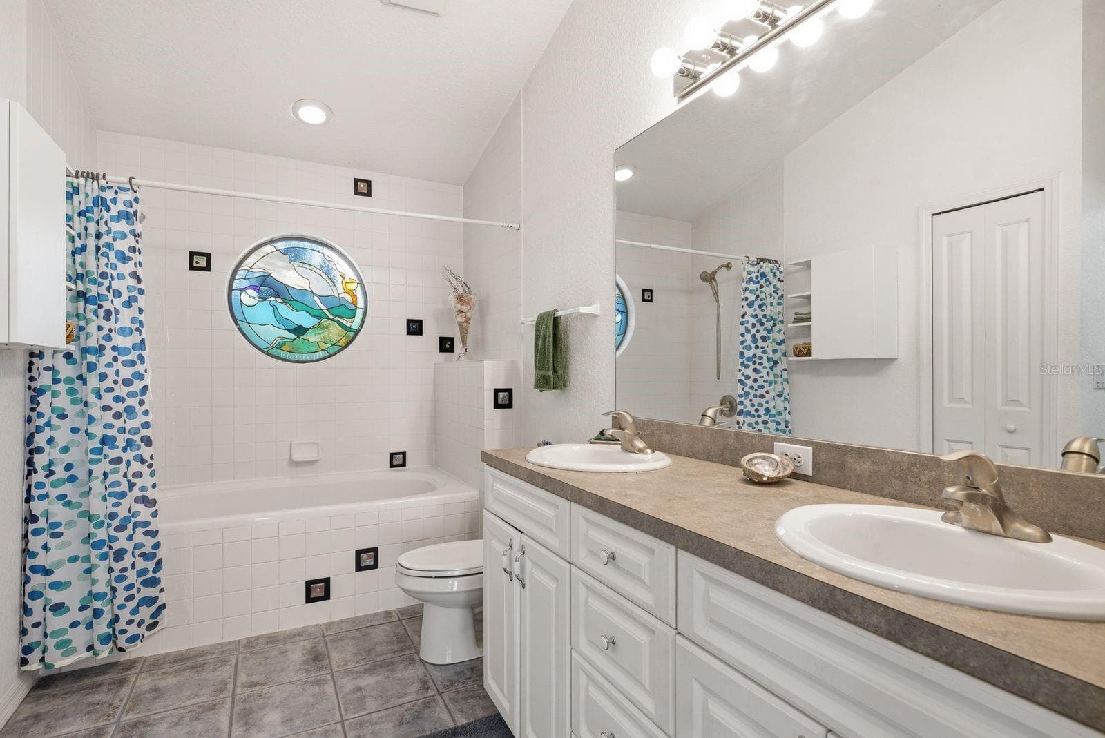 En Suite Primary bathroom with double vanity & linen closet.. - 755 SAN CHRISTOPHER DR, DUNEDIN