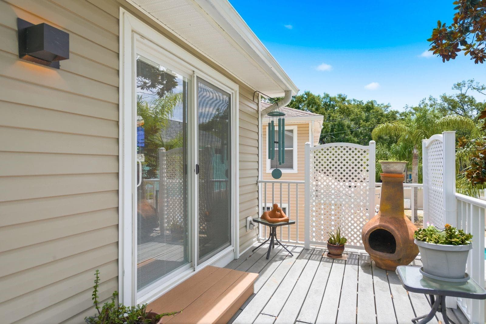 Sliding glass door from Primary Bedroom onto Trex deck. - 755 SAN CHRISTOPHER DR, DUNEDIN