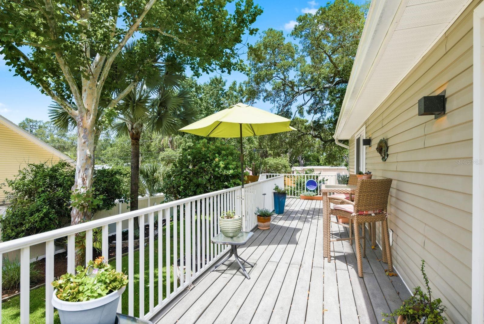 Trex upstairs deck overlooking beautifully landscaped backyard. - 755 SAN CHRISTOPHER DR, DUNEDIN