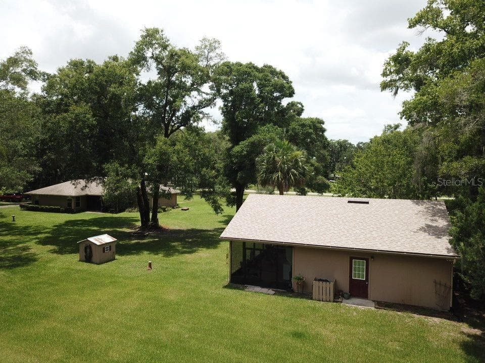 Drone shot of GUEST house and main house behind it - 267 N ORANGE AVE, LAKE HELEN