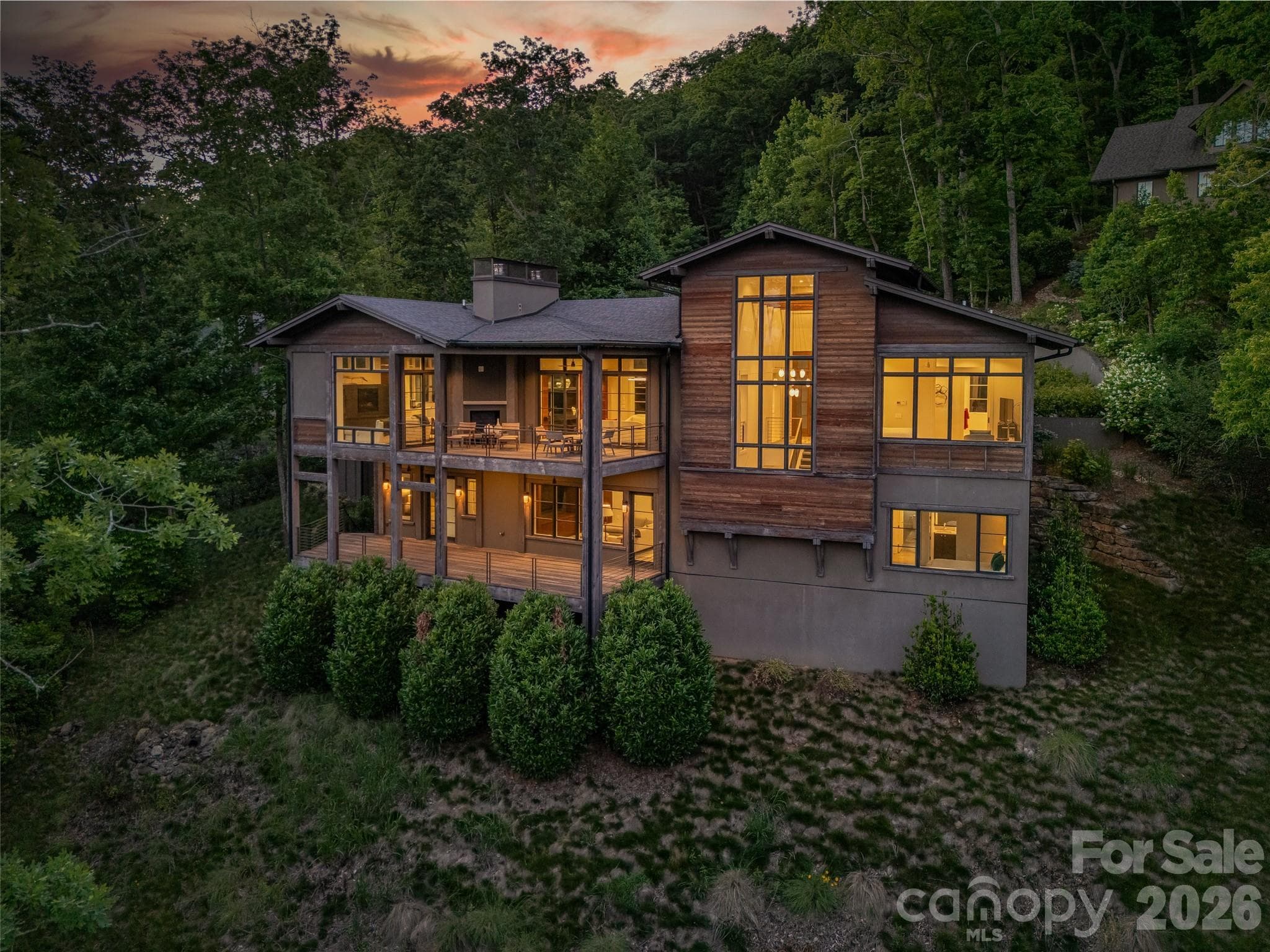 Evening illumination highlights the home's warm contemporary character - 1121 Timberbluff Way, Arden