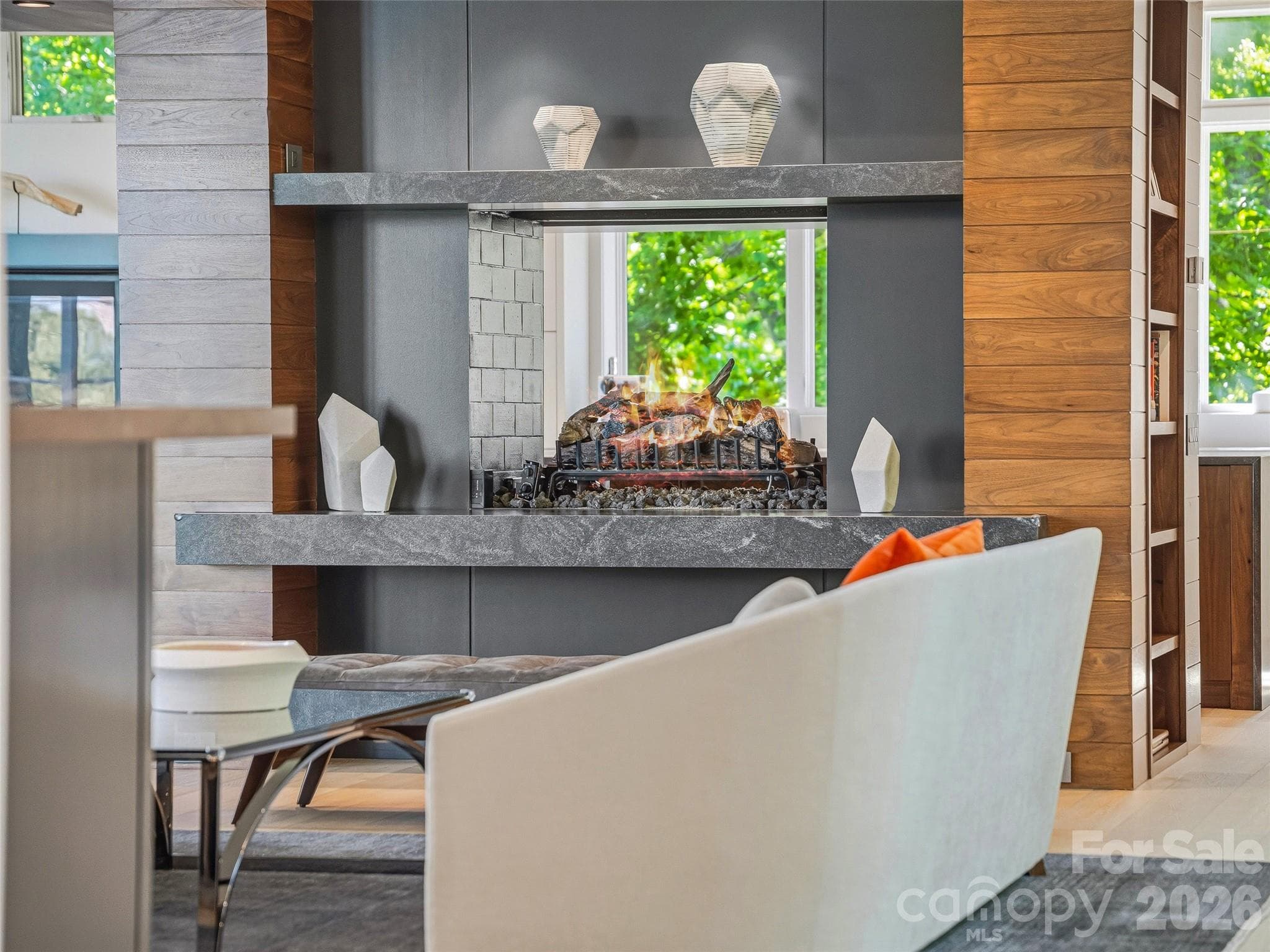 Great room anchored by a striking two-sided fireplace - 1121 Timberbluff Way, Arden