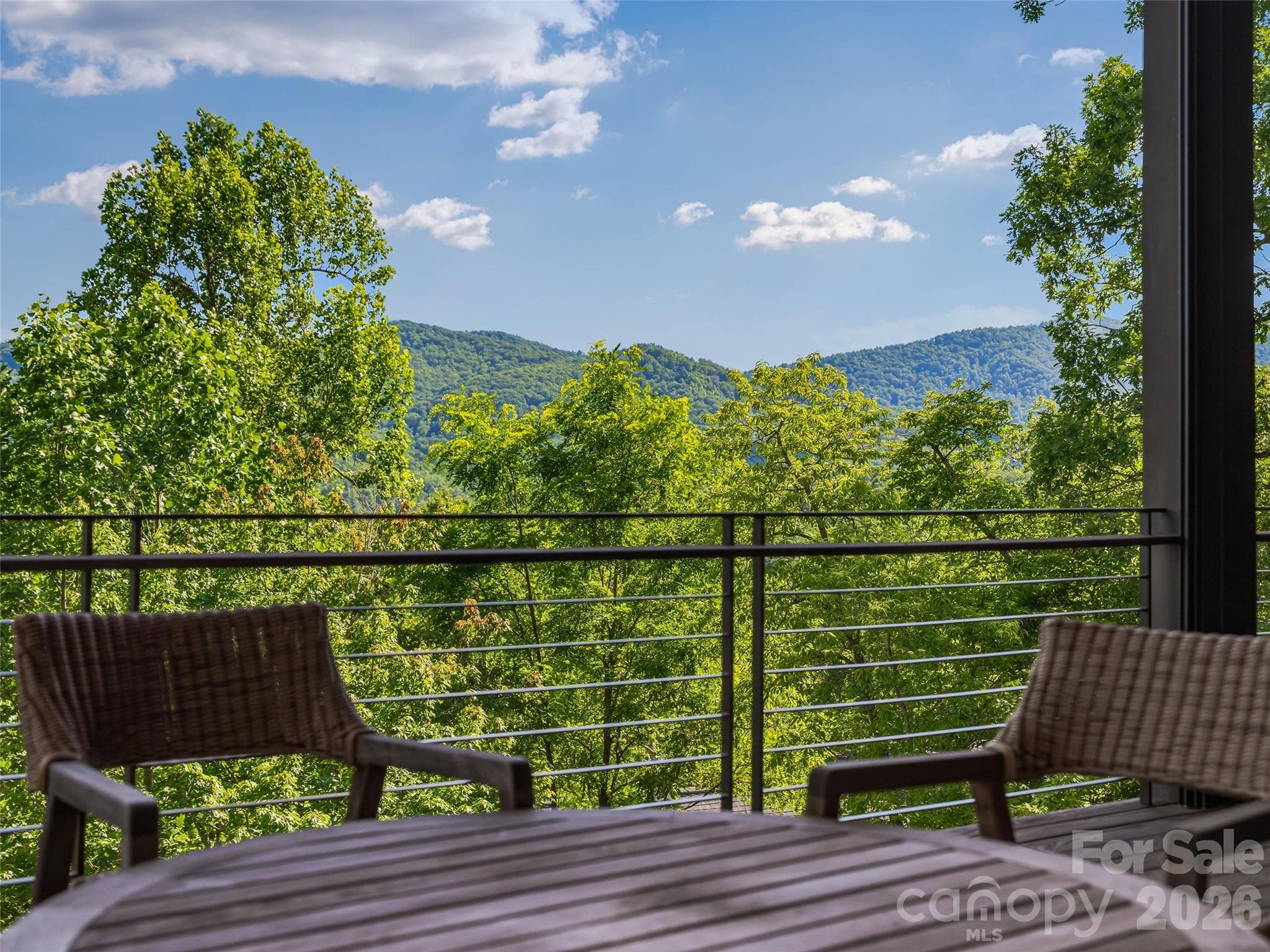 Main-level outdoor living with sweeping mountain backdrop - 1121 Timberbluff Way, Arden