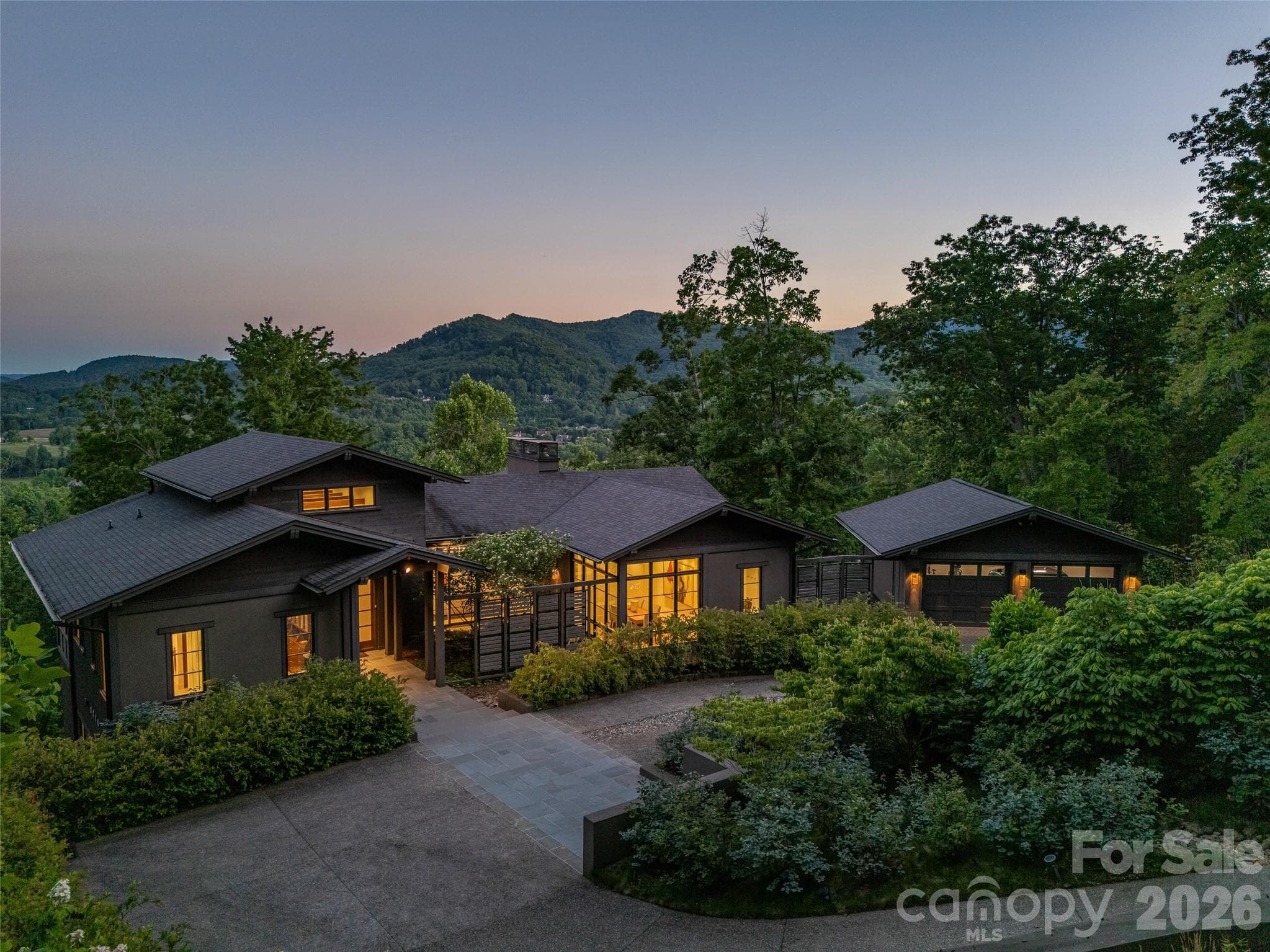 Twilight aerial showcasing privacy, architecture, and long-range views - 1121 Timberbluff Way, Arden