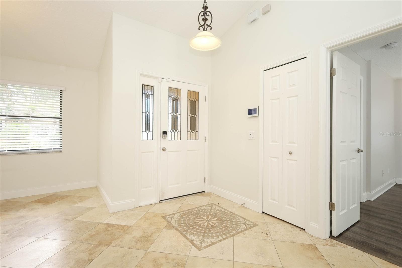 Foyer with Travertine tile flooring. - 9110 PALM TREE DR, WINDERMERE