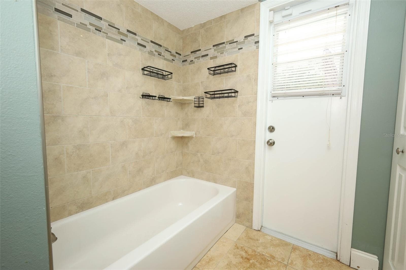 2nd full bathroom / pool bathroom. - 9110 PALM TREE DR, WINDERMERE