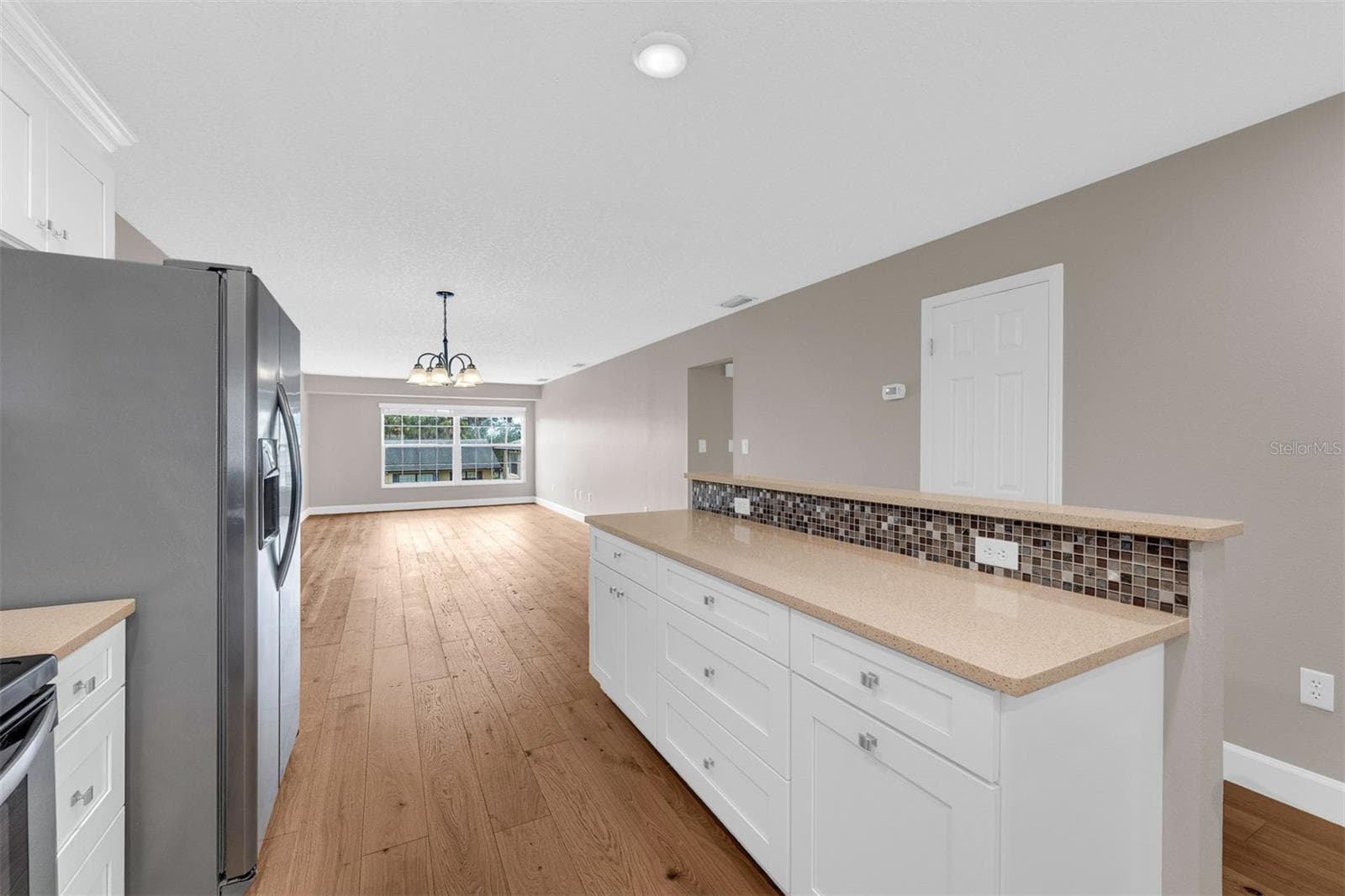 Brand New Wide Plank Wood Flooring Throughout - 110 N TREMAIN ST #209, MOUNT DORA