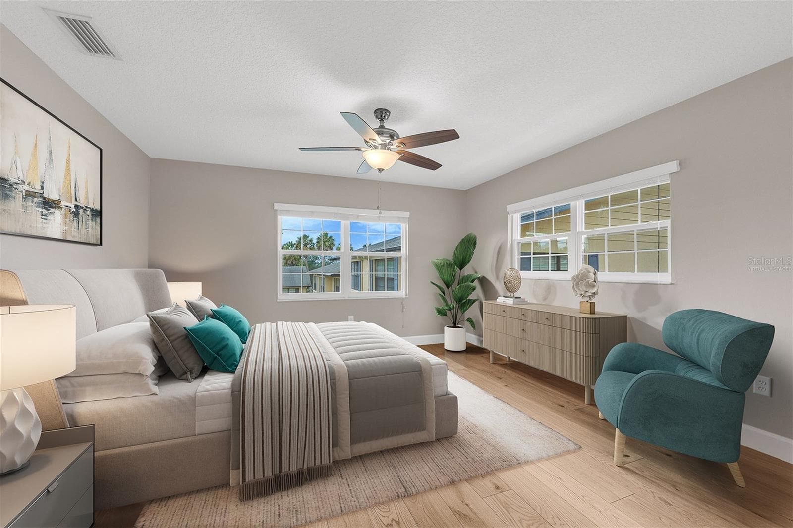 Primary Suite. Corner unit provides tons of natural light. Virtually Staged. - 110 N TREMAIN ST #209, MOUNT DORA