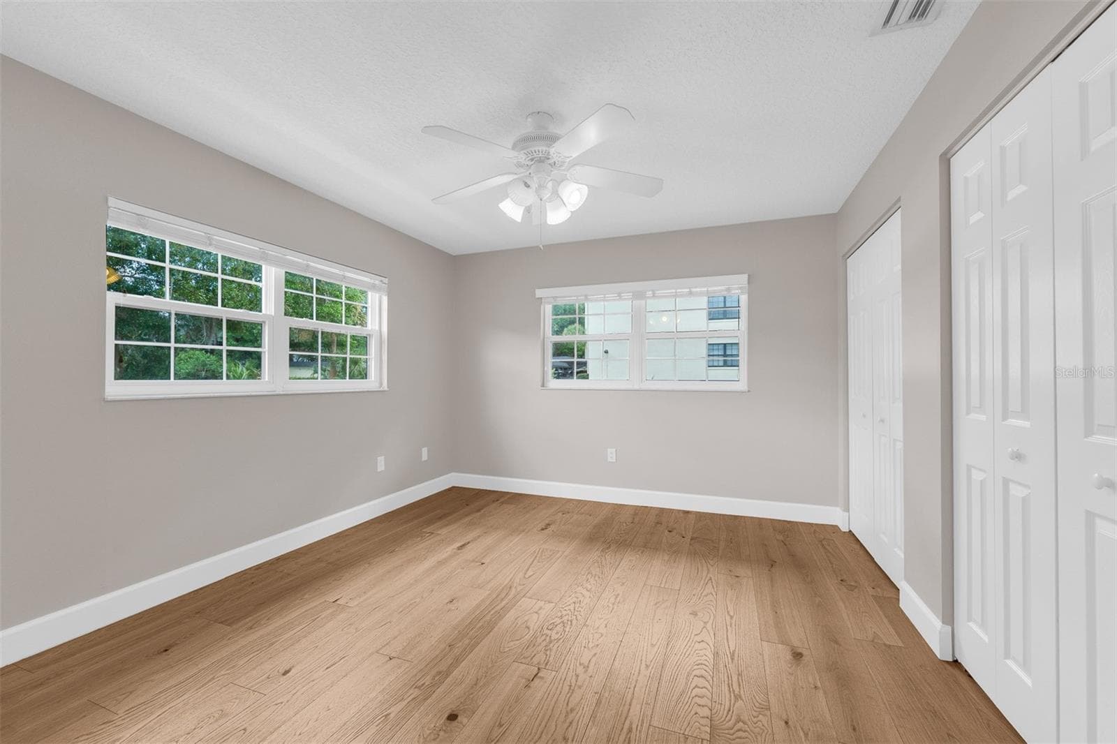 2nd Bedroom.  Double closet and lots of natural light - 110 N TREMAIN ST #209, MOUNT DORA