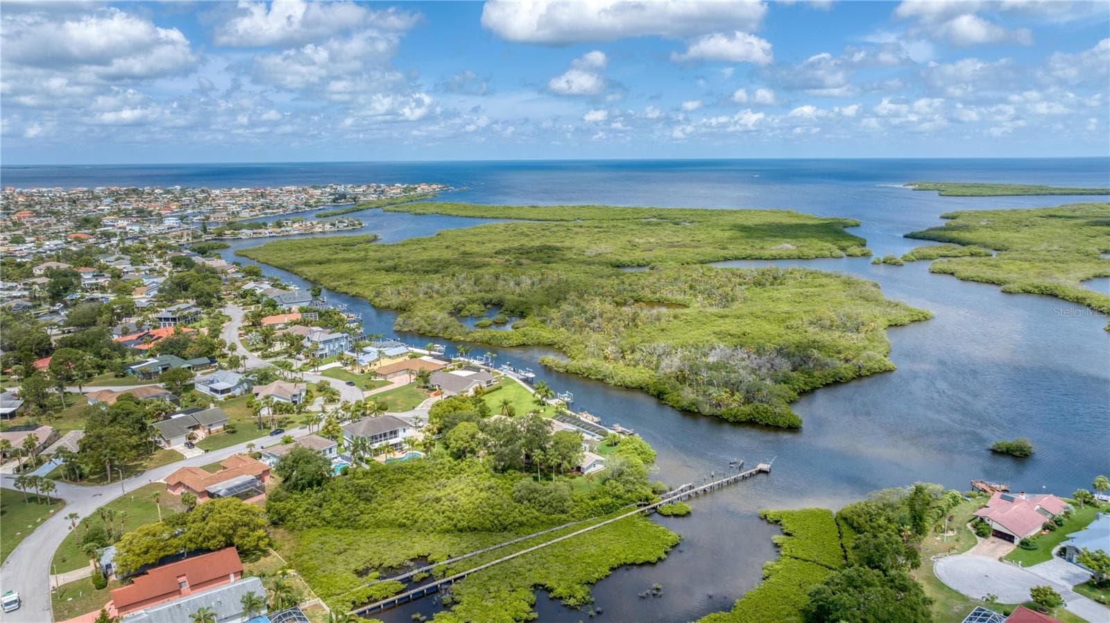 Aerial view of property looking West towards Gulf with deep channel access - 5623 HULL CT, NEW PORT RICHEY