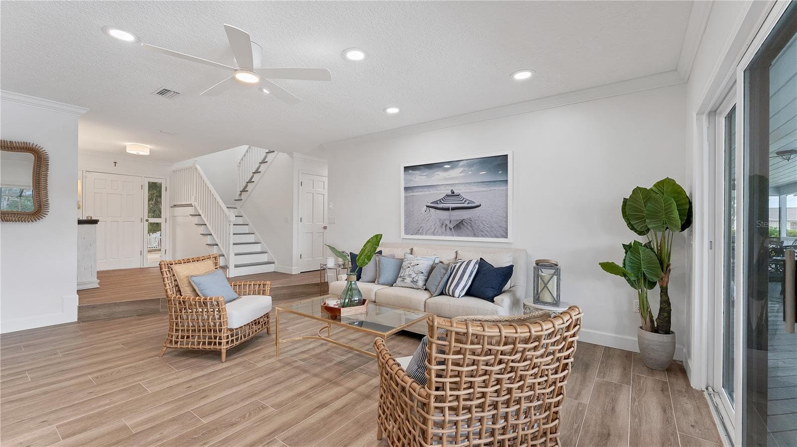 Family room looking from wet bar area(previously staged) - 5623 HULL CT, NEW PORT RICHEY