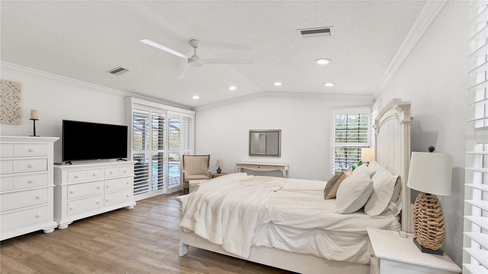 Primary suite with sliding doors to pool area.(previously staged) - 5623 HULL CT, NEW PORT RICHEY