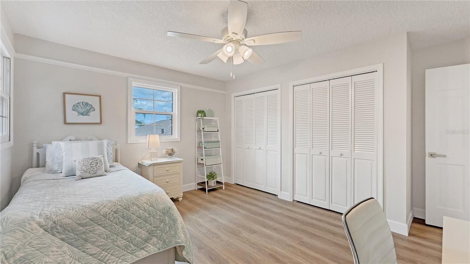 Upstairs bedroom 1 at top of stairs on left(previously staged) - 5623 HULL CT, NEW PORT RICHEY