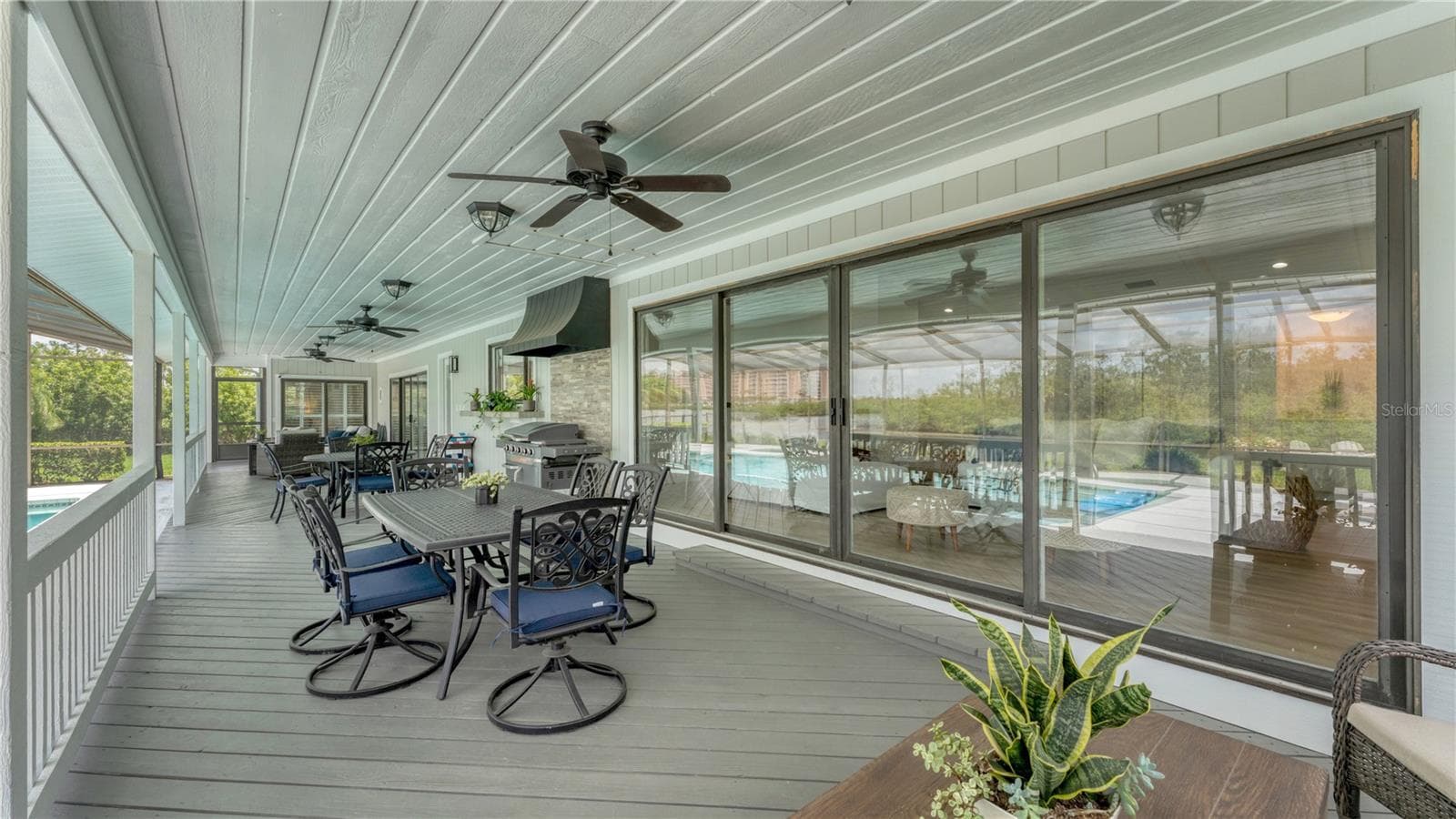 Outdoor back patio and gas grill with hood (previously staged) - 5623 HULL CT, NEW PORT RICHEY