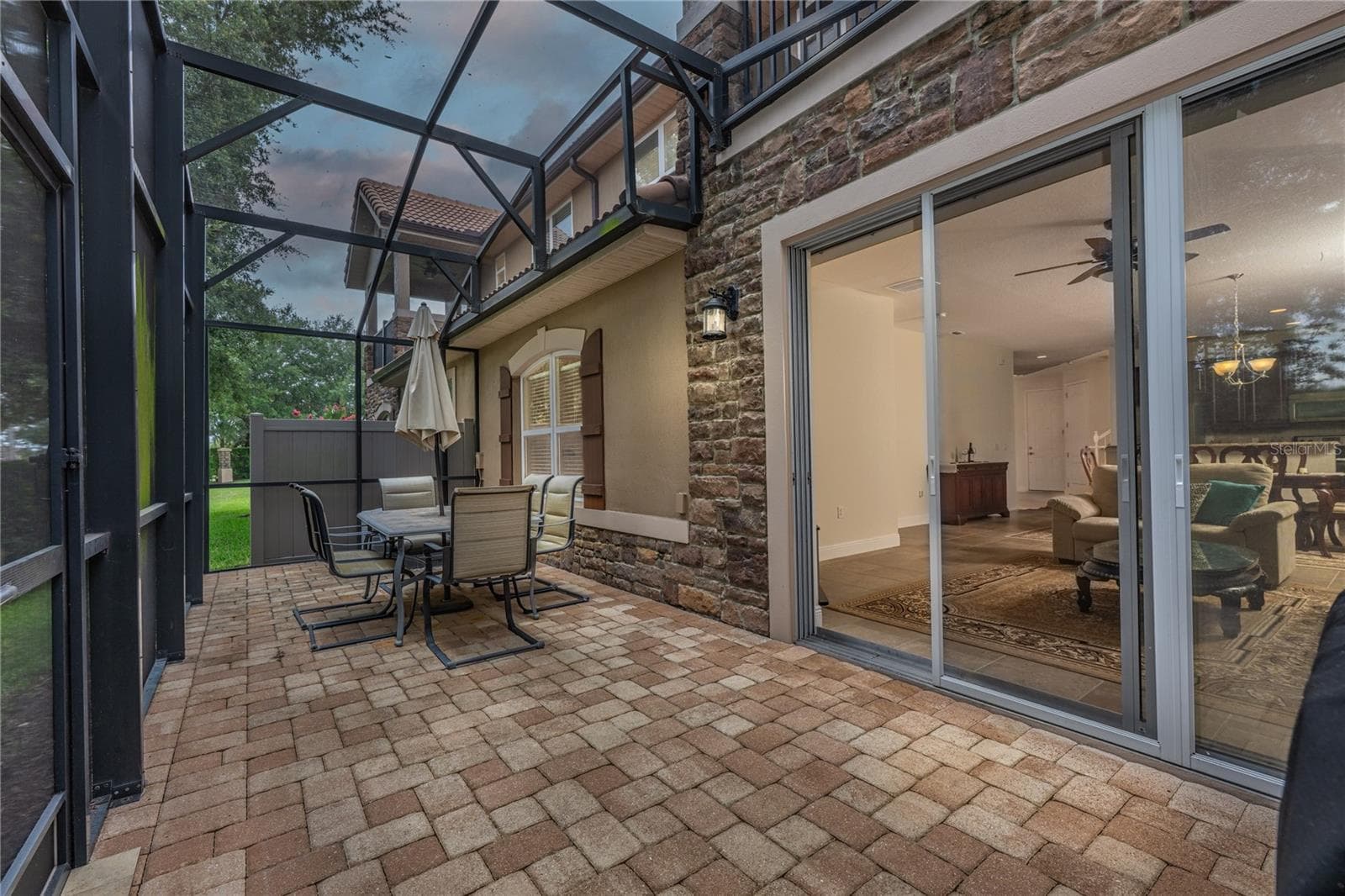Screened in patio outside the living room - 10751 BELFRY CIR, ORLANDO