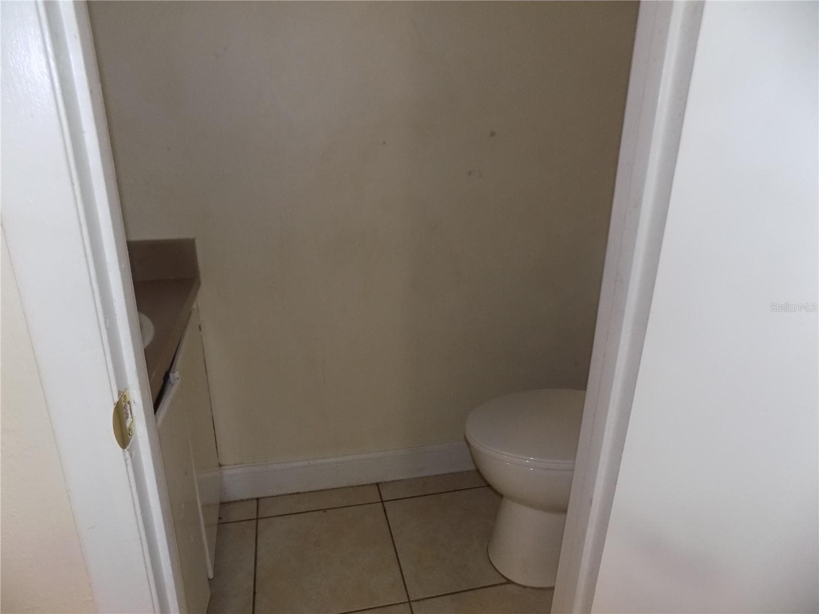 A toilet downstairs - 713 SW 69 ST, GAINESVILLE