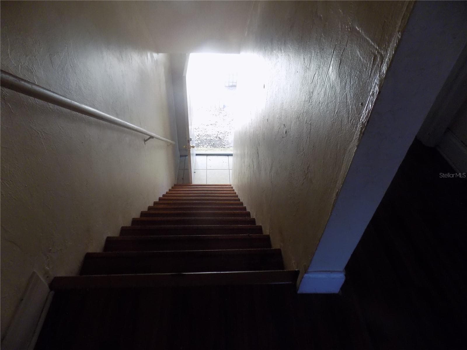 A stairs look down to front door - 713 SW 69 ST, GAINESVILLE