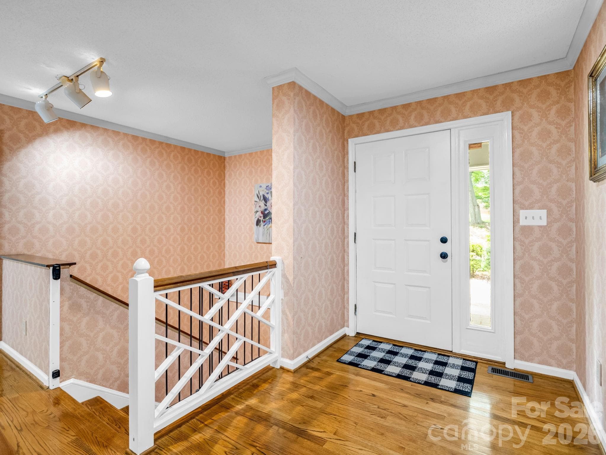 Entry open to living area, stairs to lower level - Shelby