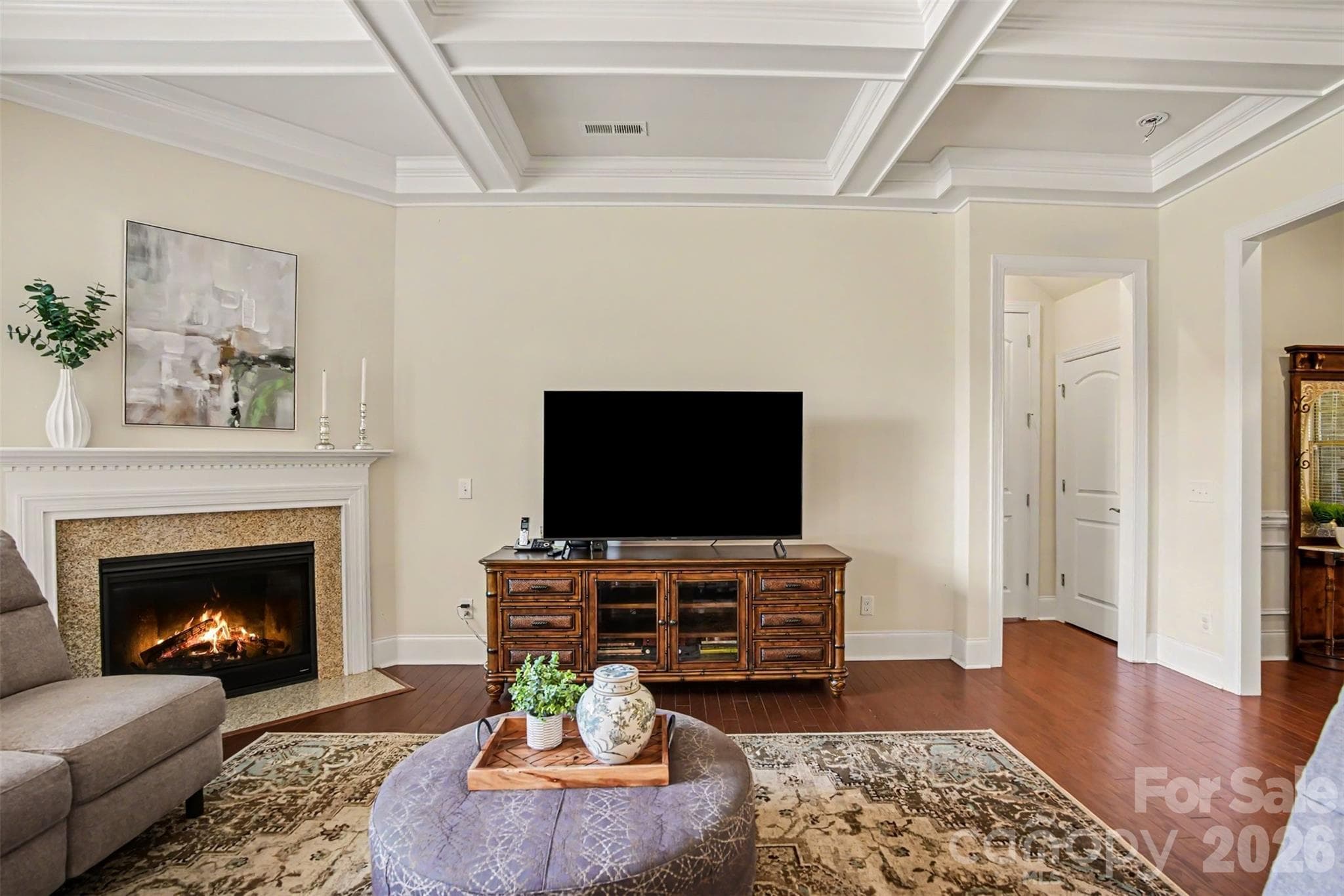 Corner gas log fireplace with granite surround. - 3605 Jumprock Road, Indian Land