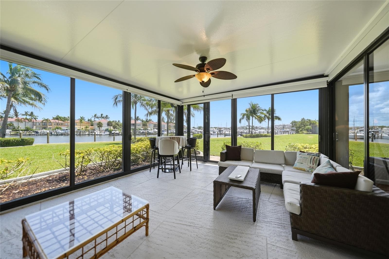 OUTDOOR LIVING area. Open up the hurricane sliders for the Florida breeze or close it if its chilly. - 3230 SOUTHSHORE DR #34A, PUNTA GORDA
