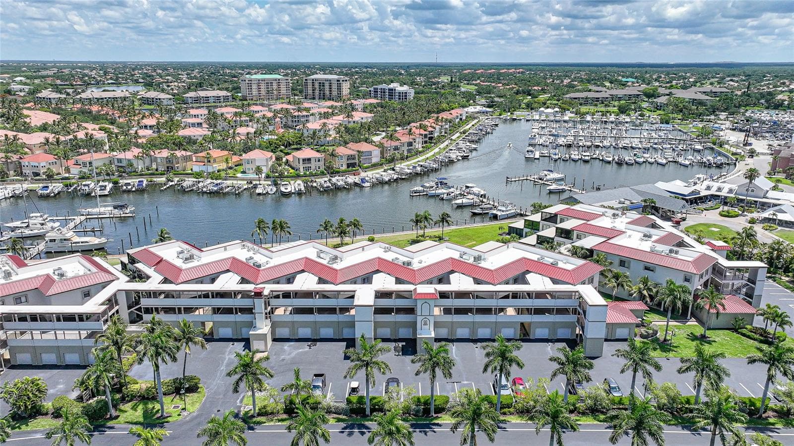 Front view looking over marina and building. - 3230 SOUTHSHORE DR #34A, PUNTA GORDA