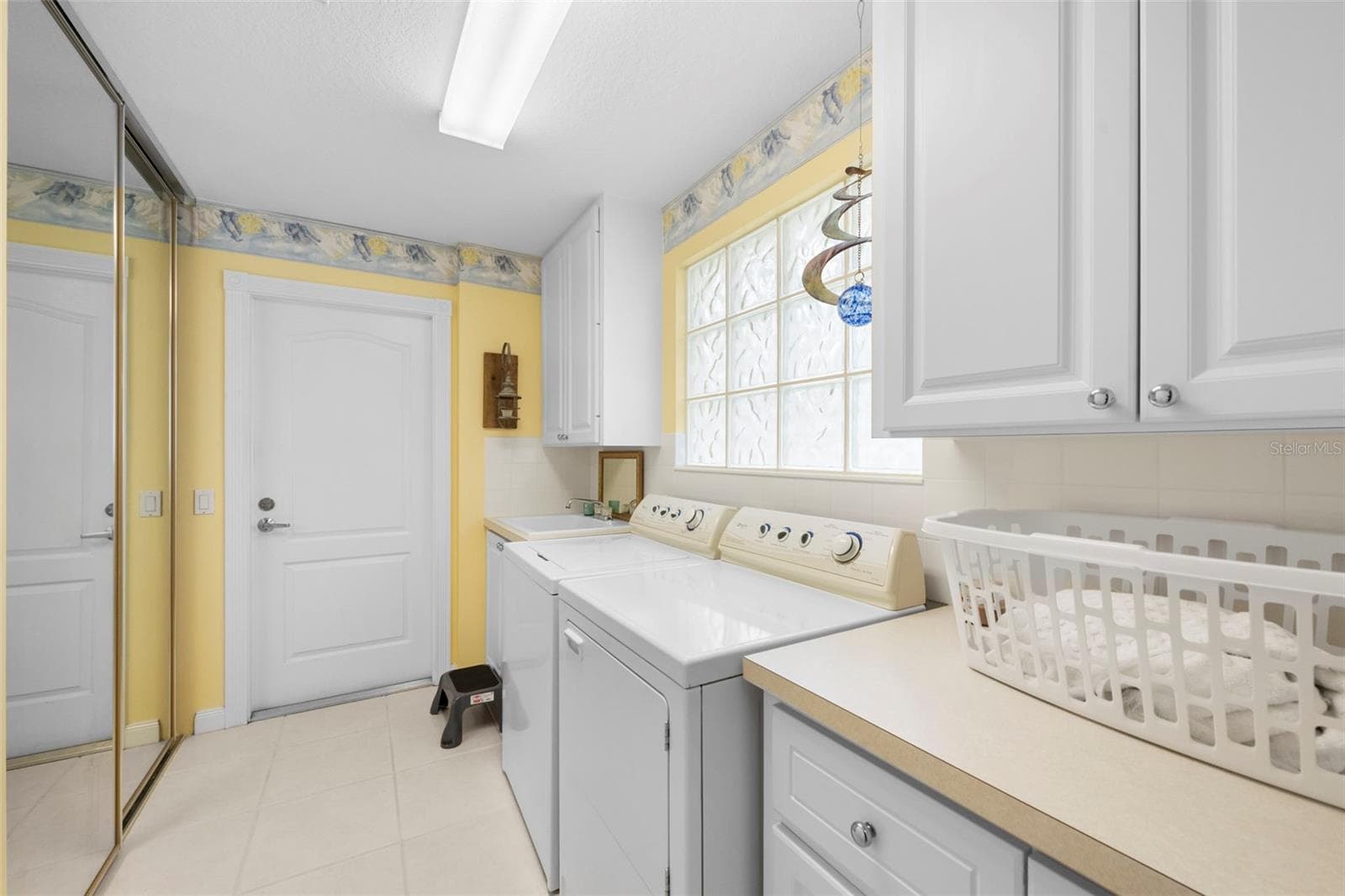 Laundry room with additional storage - 5793 ITHACA WAY, SARASOTA