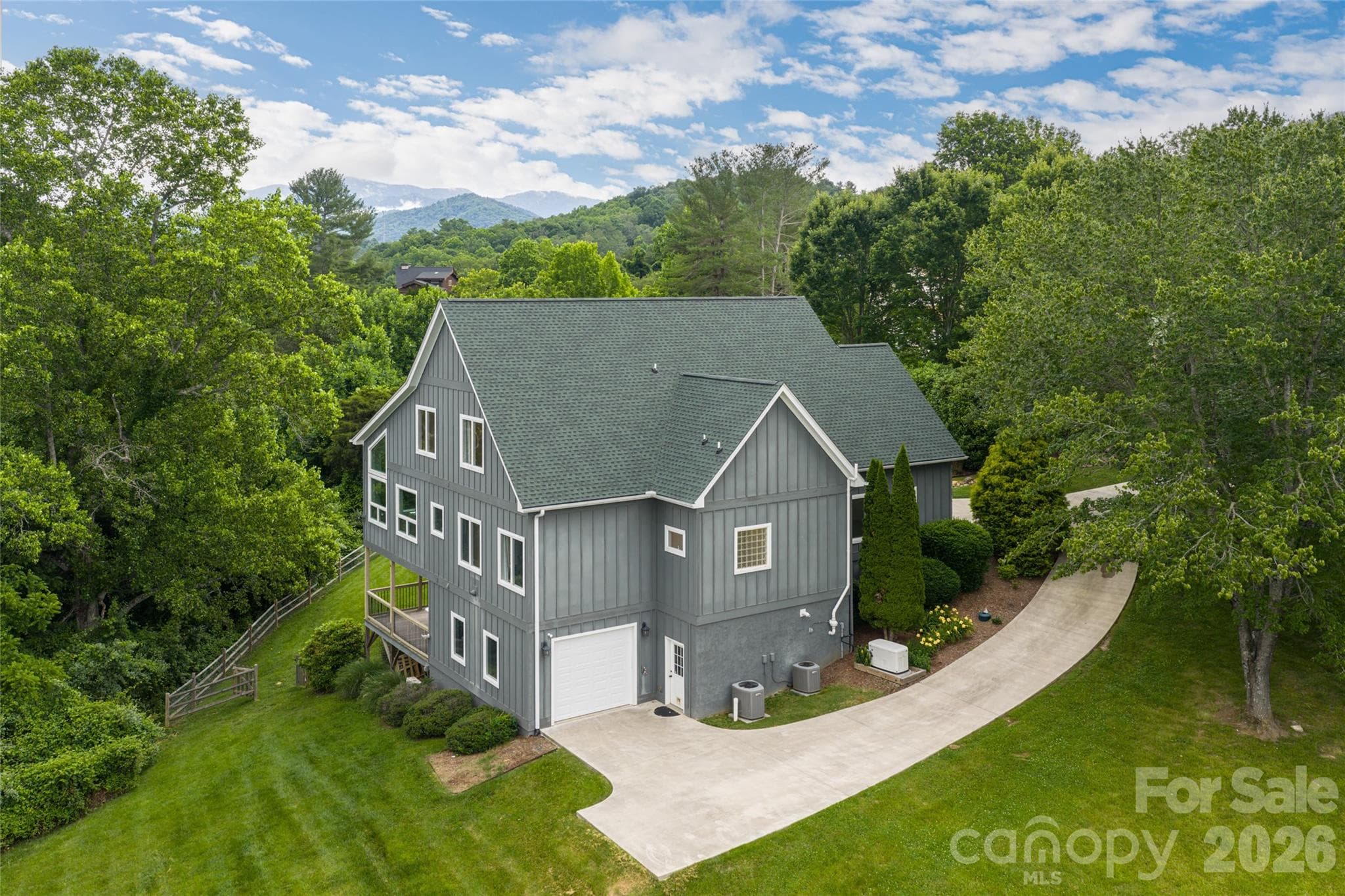2 car garage on main level with an additional 3rd garage in basement. - 33 Bridle Path Drive, Barnardsville