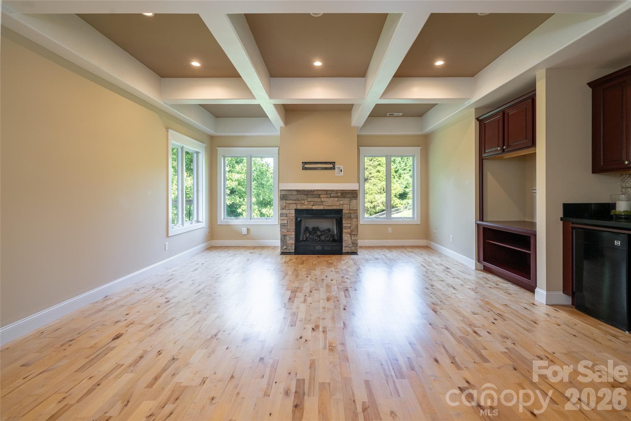 This exceptional lower-level living space is filled with abundant natural light and offers incredible versatility for a variety of needs. - 33 Bridle Path Drive, Barnardsville