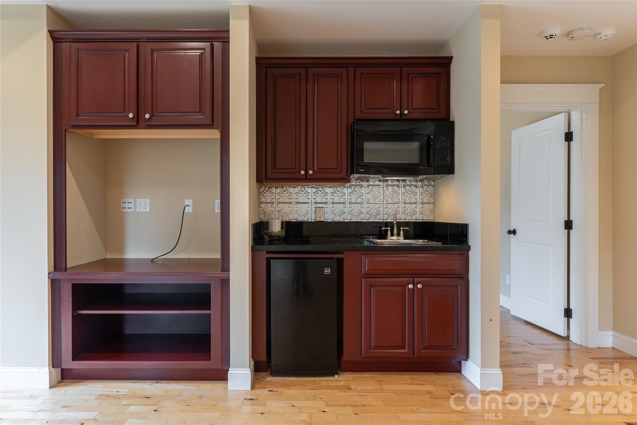 Lower level includes a kitchenette, a third fireplace, private guest room and guest bathroom - 33 Bridle Path Drive, Barnardsville