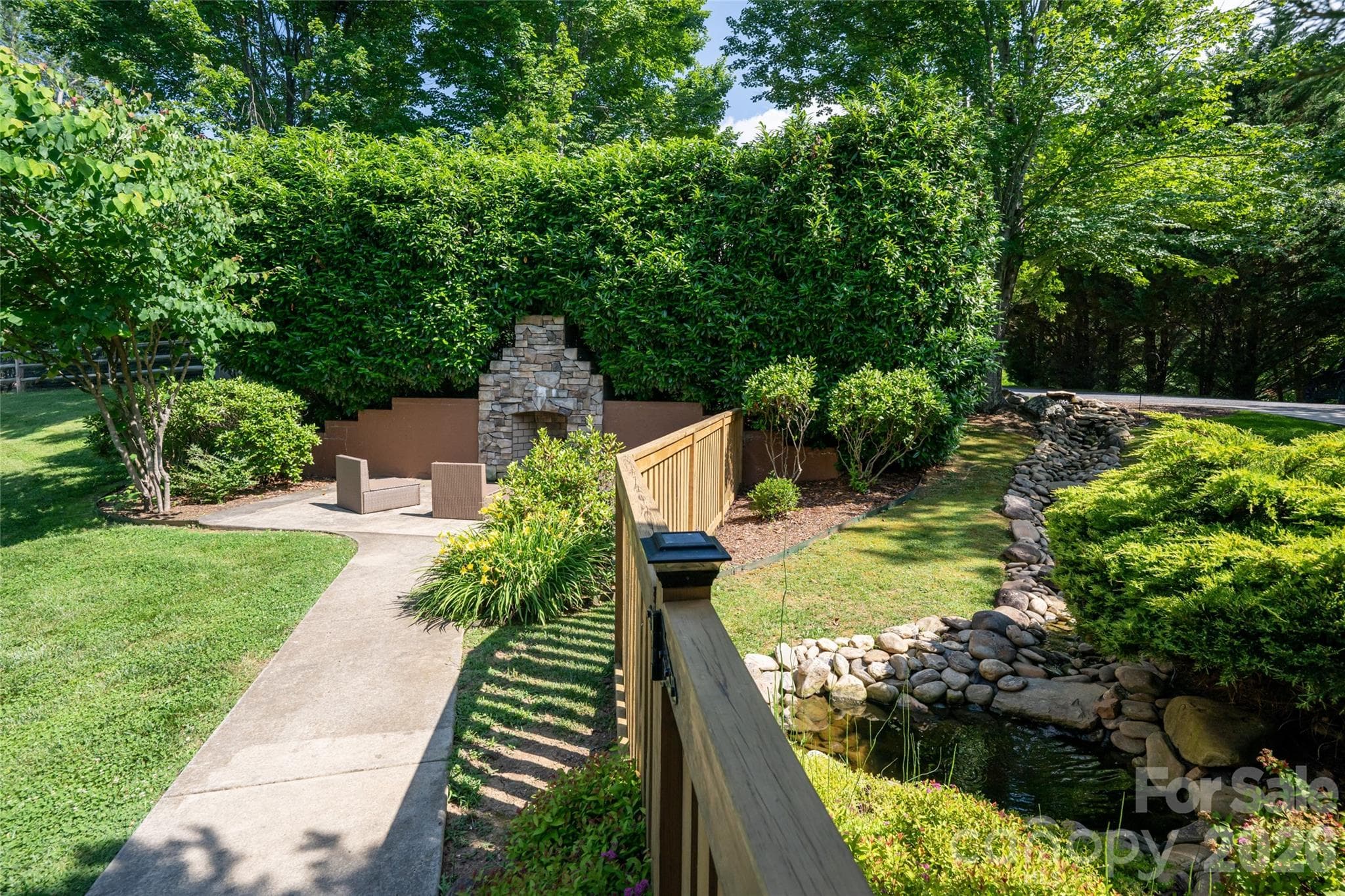 Enjoy an outdoor fireplace featuring beautiful stacked stone - 33 Bridle Path Drive, Barnardsville