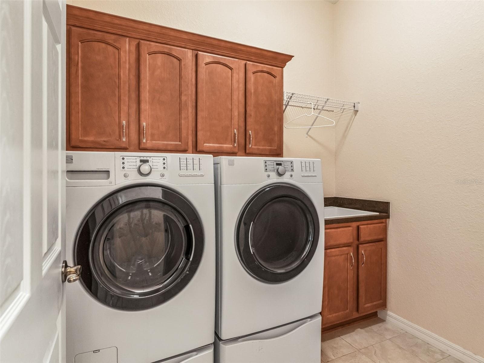 Inside Laundry rm w/Utility sink & Extra cabinets - 16887 SE 110TH COURT RD, SUMMERFIELD