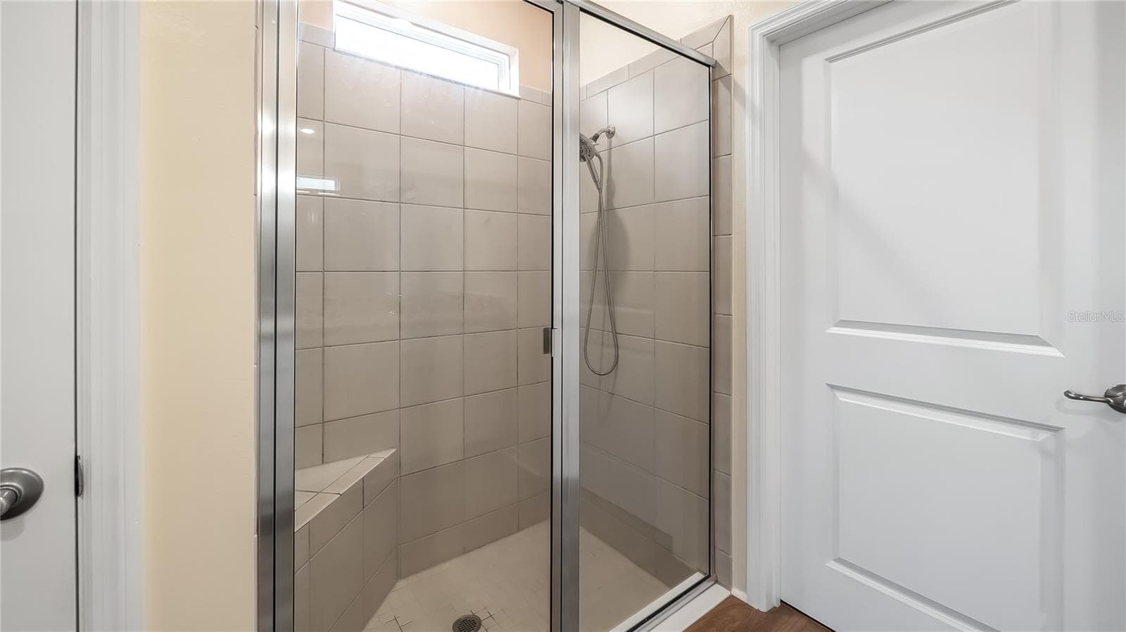 Primary bathroom with dual vanity and walk-in closet and shower. - 8033 PENROSE PL, WILDWOOD