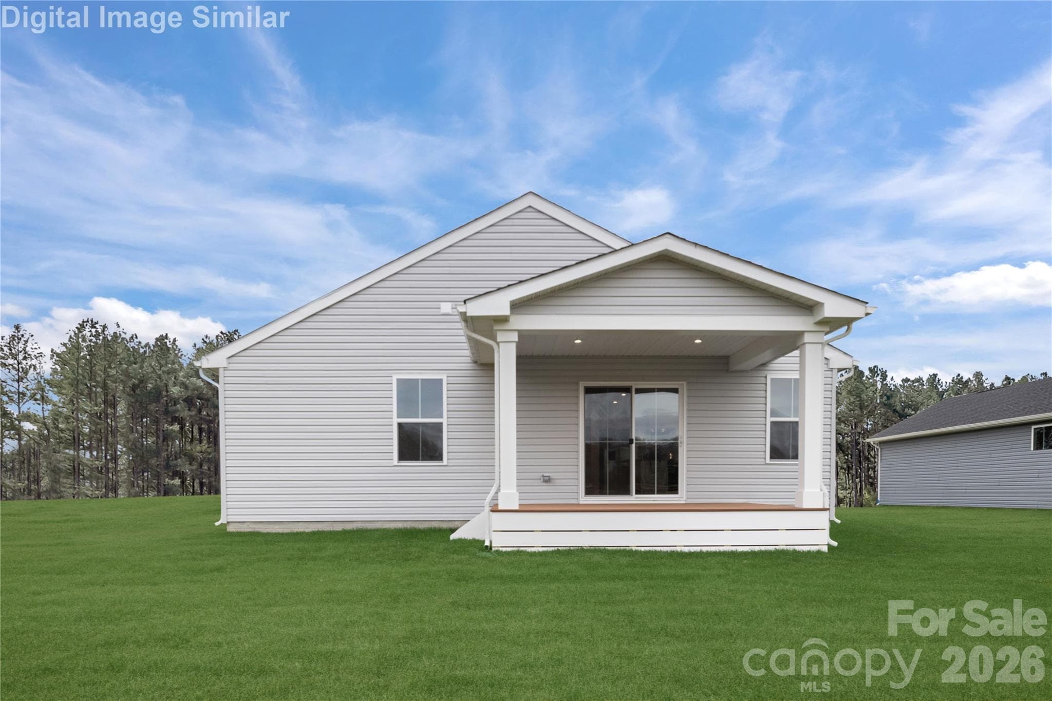 There's something timeless about a covered porch - a space that invites you to slow down, sip something warm, and watch the world go by. - 208 Linwood Estates Drive, Lexington