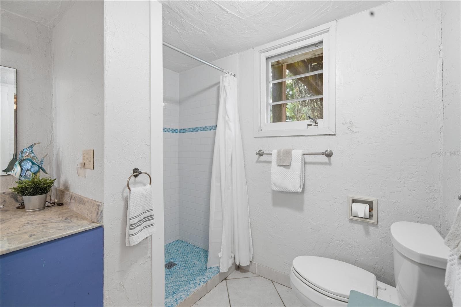 Updated bath with modern fixtures and clean, move-in-ready presentation. - 411 W 48TH ST, BRADENTON