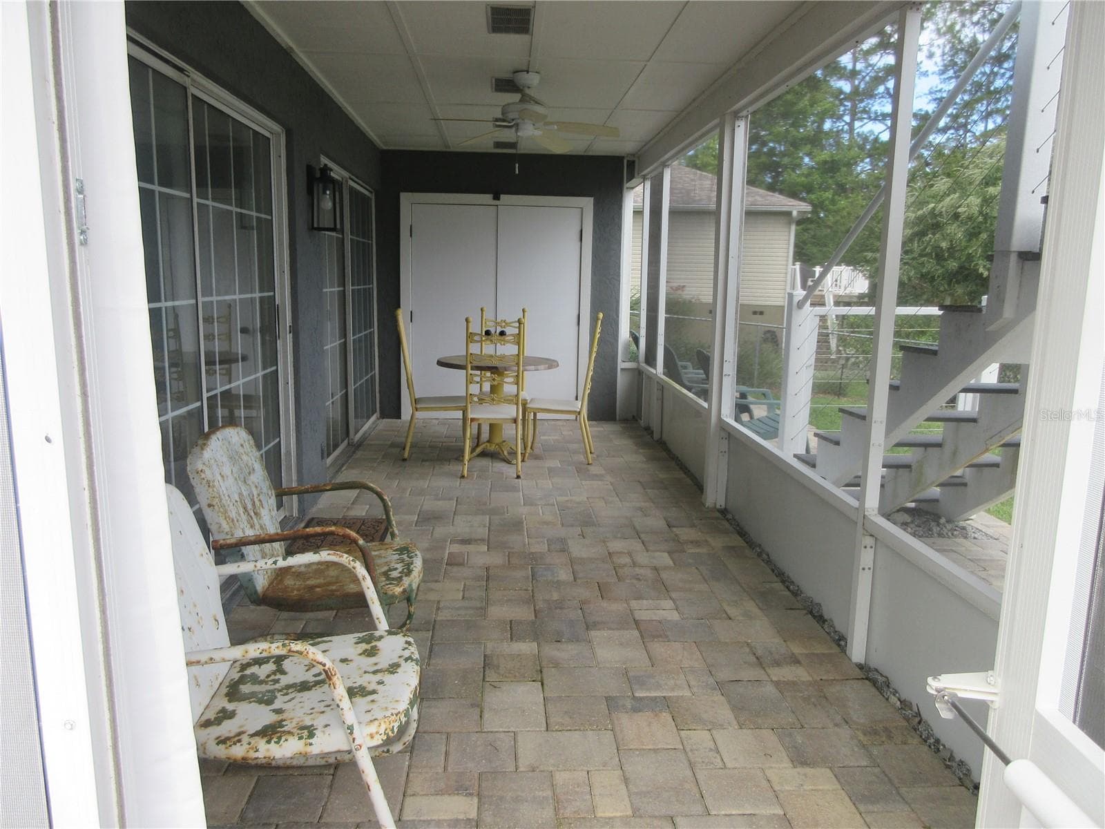 bottom story screened veranda / storage room - 16849 SE 59TH PL, OCKLAWAHA