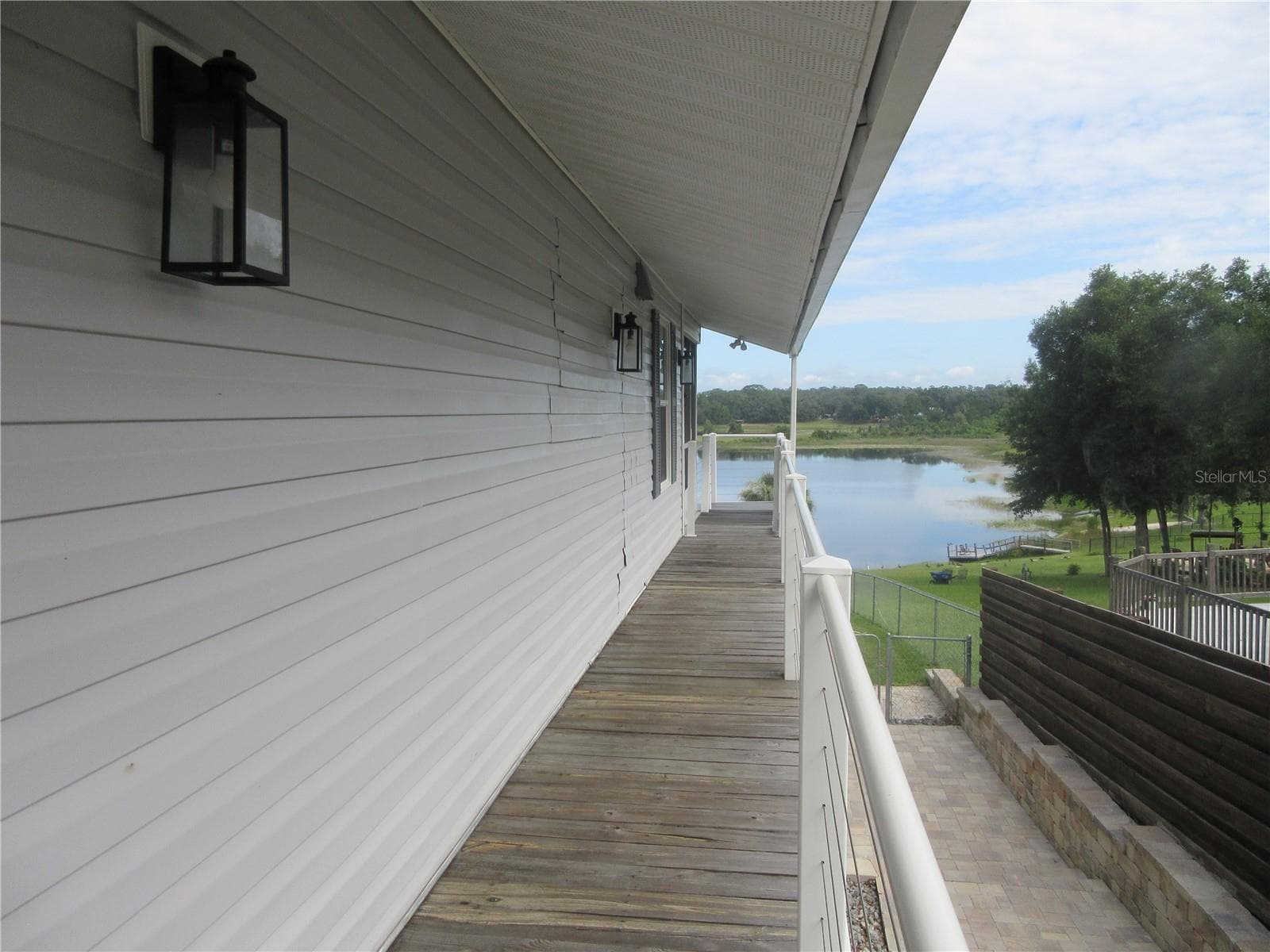 second story balcony walkway - 16849 SE 59TH PL, OCKLAWAHA