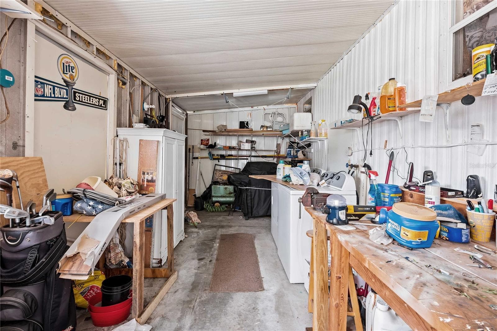Laundry area and workshop. - 3834 SARAH DR, WESLEY CHAPEL