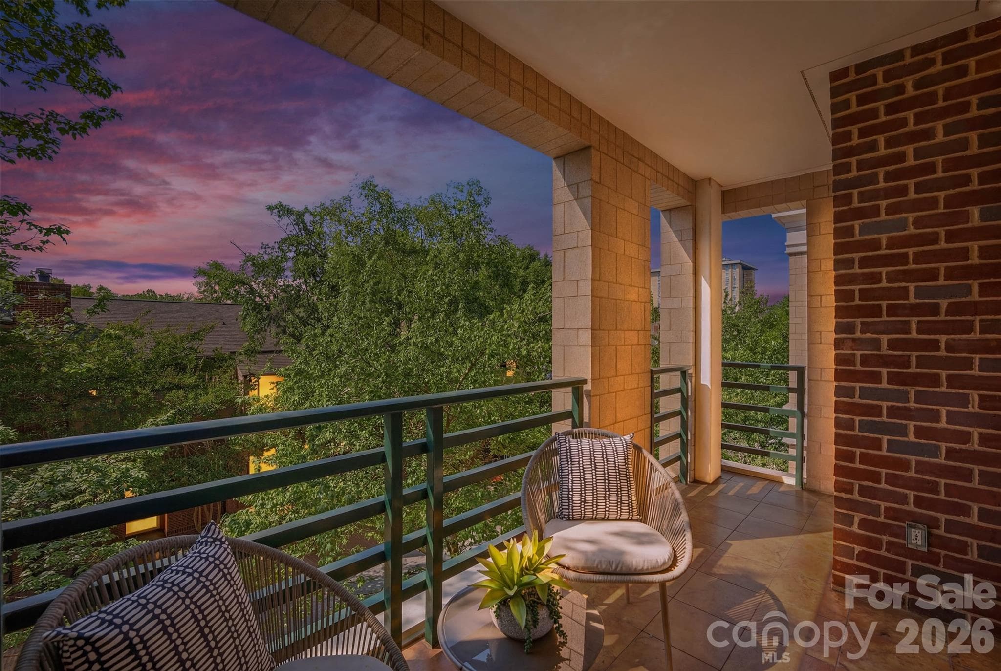 Sip, unwind, and watch the Charlotte sky turn every shade of pink and purple from your private balcony surrounded by lush treetops this is Uptown living at its most spectacular. - Charlotte