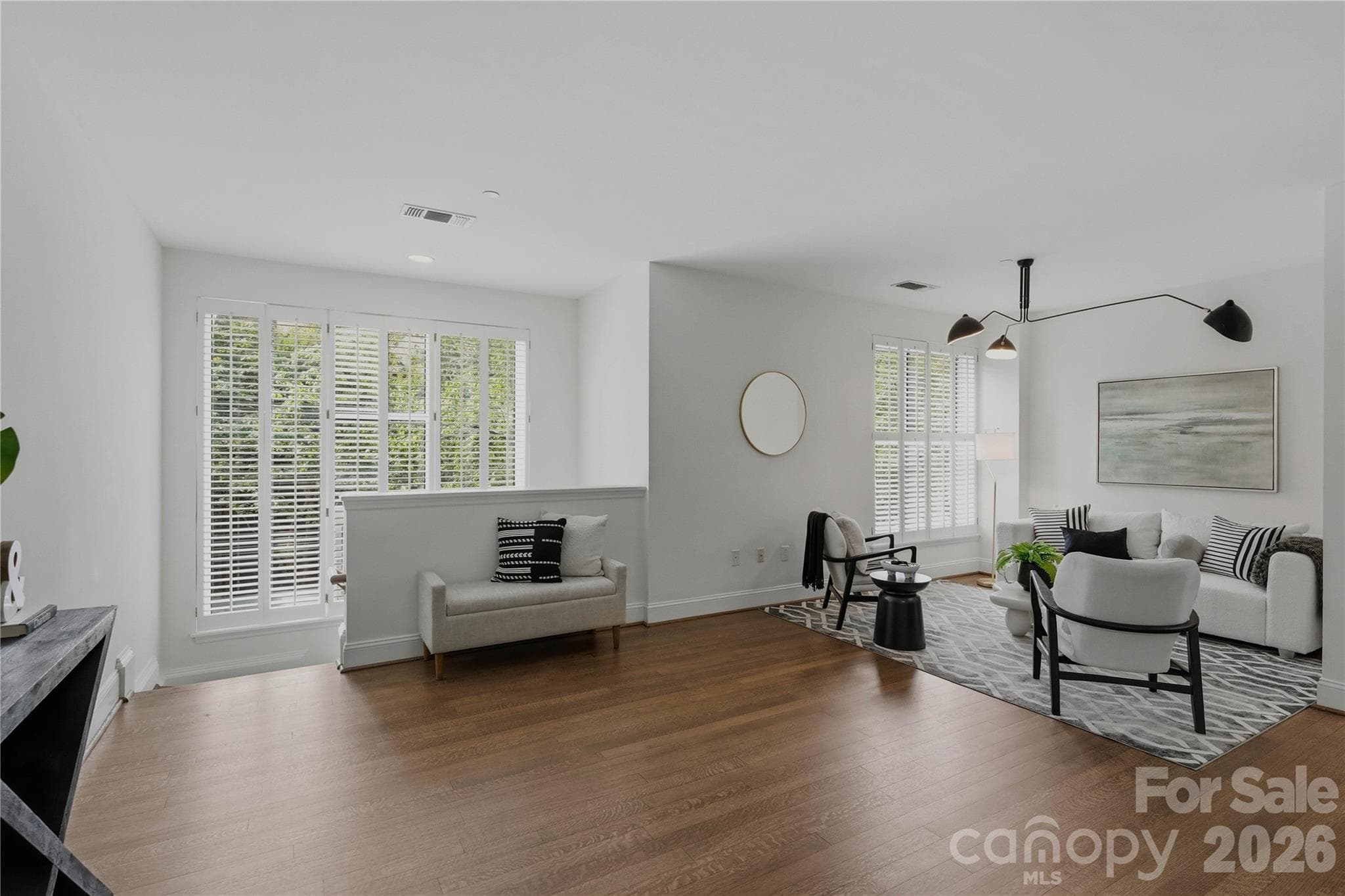 The grand view you've been looking for as the sweeping open-concept main level connects living, dining, kitchen, and staircase in one breathtaking space perfect for entertaining - Charlotte