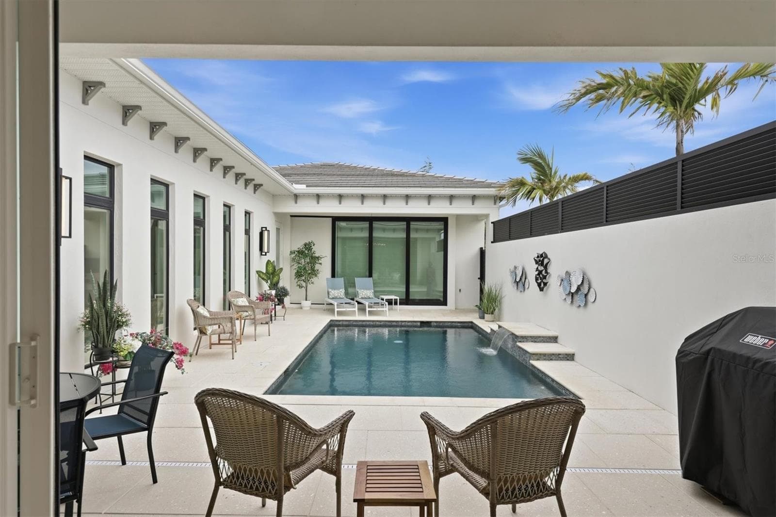 View of Pool from Kitchen - 5931 CAT CLAW LN, BRADENTON
