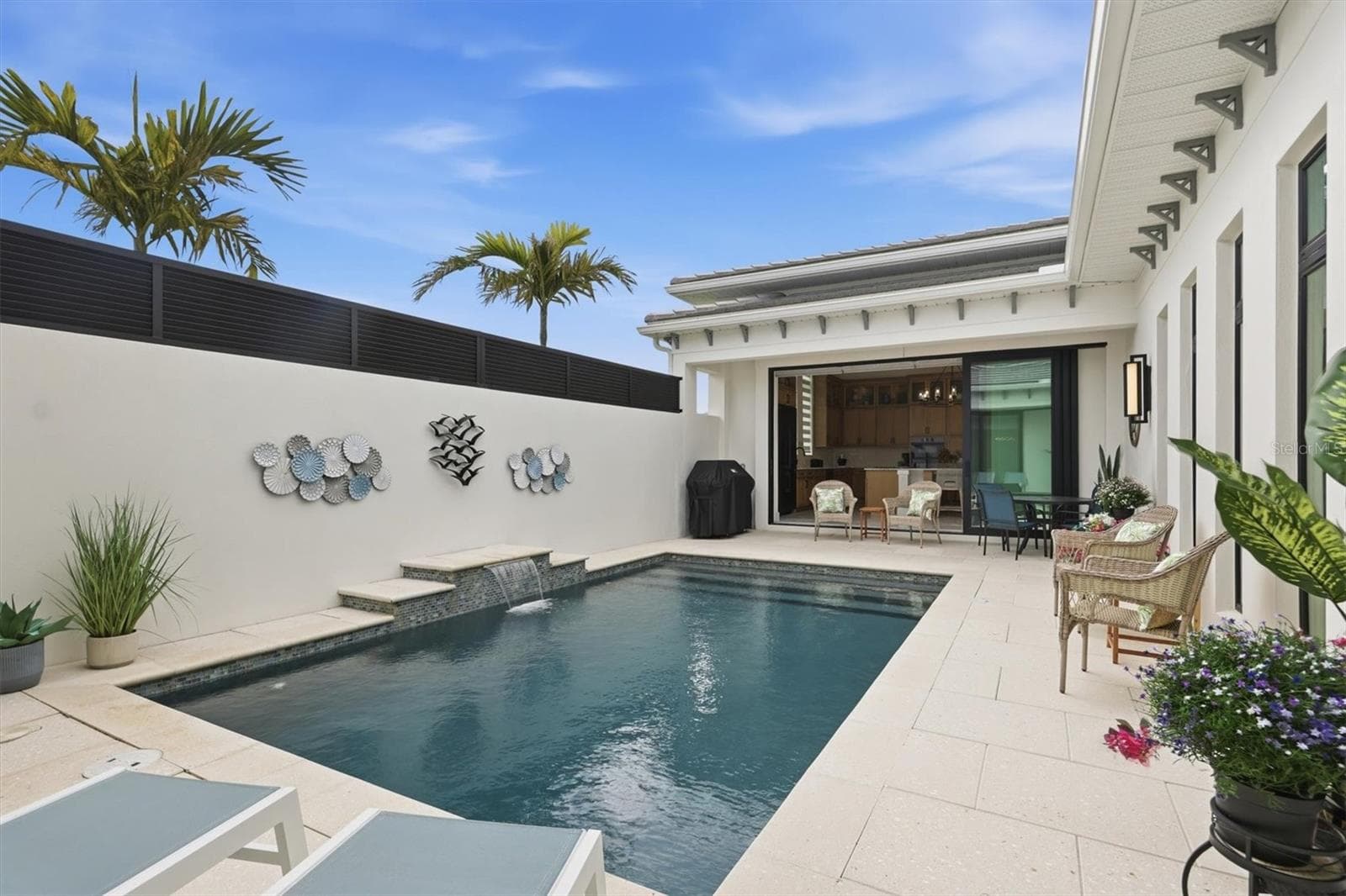 View of Pool from Primary Bedroom - 5931 CAT CLAW LN, BRADENTON